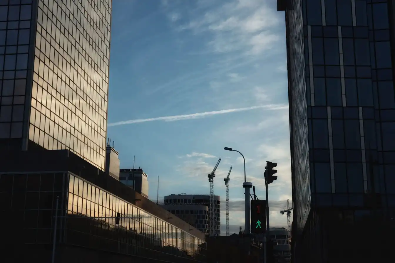 Modern office buildings in Brussels at sunset.